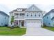 Charming two-story home with a welcoming front porch and well-maintained landscaping at 1100 Saltwater Cir, Johns Island, SC 29455
