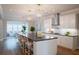 Bright and airy kitchen with a large island, stainless steel appliances, and views into the living room at 1100 Saltwater Cir, Johns Island, SC 29455