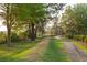 Community pathway under shaded trees at 1100 Saltwater Cir, Johns Island, SC 29455