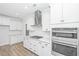 Modern kitchen with white cabinetry, stainless steel appliances, subway tile backsplash, and island at 111 Sawlog Dr, Summerville, SC 29486