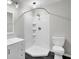Bathroom features a white corner shower with tiled walls and black flooring at 113 Dove Ln, Summerville, SC 29485