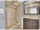 Modern bathroom featuring a tub and shower combo, vanity, and modern mirror at 113 Dove Ln, Summerville, SC 29485