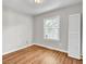 Bright bedroom with natural light, wood flooring, and a white closet at 113 Dove Ln, Summerville, SC 29485