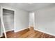 Bedroom with wood floors and an open closet at 113 Dove Ln, Summerville, SC 29485