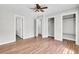 Spacious bedroom with wood floors, ceiling fan, and ample closet space at 113 Dove Ln, Summerville, SC 29485
