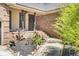 A welcoming front entrance with red brick steps and a landscaped garden area at 113 Dove Ln, Summerville, SC 29485