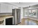 Bright kitchen featuring a stainless steel refrigerator and a breakfast nook with large windows at 113 Dove Ln, Summerville, SC 29485