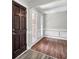 Cozy living room with hardwood floors, natural light from two windows, and classic trim at 113 Dove Ln, Summerville, SC 29485