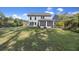 Large backyard with a screened porch, fire pit, and ample seating at 1166 Turkey Trot Dr, Johns Island, SC 29455