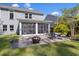 Backyard patio with a fire pit, outdoor dining set, and view of the home's exterior and screened porch at 1166 Turkey Trot Dr, Johns Island, SC 29455