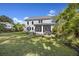 Spacious backyard featuring a patio, outdoor dining set, and a screened porch, perfect for entertaining at 1166 Turkey Trot Dr, Johns Island, SC 29455