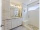 The primary bathroom has double sinks, a large mirror, and a glass-door shower at 1166 Turkey Trot Dr, Johns Island, SC 29455