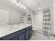 Stylish bathroom featuring a double vanity, modern lighting, and a shower-tub combo at 1166 Turkey Trot Dr, Johns Island, SC 29455