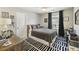 This bedroom features a window with black curtains and wood-style furniture at 1166 Turkey Trot Dr, Johns Island, SC 29455