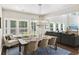 Bright dining area featuring a wooden table with seating, a modern chandelier, and lots of natural light at 1166 Turkey Trot Dr, Johns Island, SC 29455