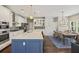 Bright, open kitchen featuring a large island with seating, stainless steel appliances, and dining area at 1166 Turkey Trot Dr, Johns Island, SC 29455
