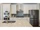 Modern kitchen with stainless steel appliances, white cabinets, and a large island with a sink at 1166 Turkey Trot Dr, Johns Island, SC 29455