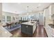 Bright open-concept living space features a spacious kitchen island, living area, and dining area at 1166 Turkey Trot Dr, Johns Island, SC 29455
