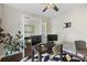 Cozy home office with modern desk setup, ceiling fan, and a beautiful geometric area rug at 1166 Turkey Trot Dr, Johns Island, SC 29455