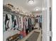 This walk-in closet is spacious and includes shelving for shoes and clothing at 1166 Turkey Trot Dr, Johns Island, SC 29455