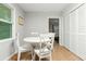 Charming dining area features white furniture and offers easy access to adjacent living spaces at 120 Lisa Dr, Summerville, SC 29485