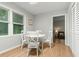 Bright dining area with white table, chairs, and natural light from a nearby window at 120 Lisa Dr, Summerville, SC 29485