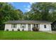 Charming white brick home features a well-maintained lawn and inviting curb appeal at 120 Lisa Dr, Summerville, SC 29485