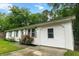 Charming white brick home features a well-maintained lawn, attached garage, and inviting curb appeal at 120 Lisa Dr, Summerville, SC 29485