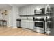 This kitchen is equipped with stainless steel appliances and updated cabinets, flooring and granite countertops at 120 Lisa Dr, Summerville, SC 29485