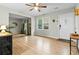 Bright living room features wood-look floors, a ceiling fan, and natural light at 120 Lisa Dr, Summerville, SC 29485