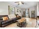 Comfortable living room with a leather sofa, wood coffee table, and warm decor at 120 Lisa Dr, Summerville, SC 29485