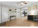 Open-concept living room with wood-look floors flows into a bright kitchen at 120 Lisa Dr, Summerville, SC 29485