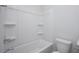Bright bathroom featuring a white tub and shower combination with built-in shelving at 121 Royal Cainhoy Way, Huger, SC 29450