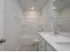 Modern bathroom with double sinks, tile flooring and tub and shower combination at 121 Royal Cainhoy Way, Huger, SC 29450