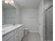 Bathroom featuring double vanity and tile shower with glass door at 121 Royal Cainhoy Way, Huger, SC 29450