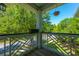 A view from the balcony, showcasing outdoor living with a hanging basket and a view of the tree tops at 1225 Blakeway St # 1401, Charleston, SC 29492