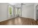 Light-filled bedroom with three windows and a ceiling fan creating a comfortable space at 1225 Blakeway St # 1401, Charleston, SC 29492