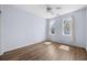Bedroom with a ceiling fan and two windows that provide natural light and charming views at 1225 Blakeway St # 1401, Charleston, SC 29492