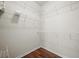 Walk-in closet with ample shelving and wood-look flooring at 1225 Blakeway St # 1401, Charleston, SC 29492