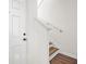 Bright entryway featuring a staircase with wood steps and a crisp white door at 1225 Blakeway St # 1401, Charleston, SC 29492