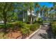 Inviting two-story home with well-maintained landscaping and mature palm trees, enhancing curb appeal at 1225 Blakeway St # 1401, Charleston, SC 29492