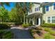 Charming home exterior with a quaint porch, lovely landscaping, and a welcoming walkway at 1225 Blakeway St # 1401, Charleston, SC 29492