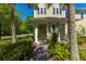 Inviting exterior view of home with covered entryway, complemented by lush greenery at 1225 Blakeway St # 1401, Charleston, SC 29492