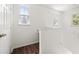 Well-lit landing area with hardwood floors and ample natural light from multiple windows at 1225 Blakeway St # 1401, Charleston, SC 29492