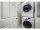 Laundry area with a stacked washer and dryer, plus shelving for storage at 1225 Blakeway St # 1401, Charleston, SC 29492