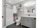 Neutral bathroom with tile floors, bathtub, and vanity with modern sink basin and fixtures at 1300 Park West Blvd # 215, Mount Pleasant, SC 29466
