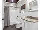Well lit bathroom with tile floors, shower-tub combo, white vanity, and elegant bronze fixtures at 1300 Park West Blvd # 215, Mount Pleasant, SC 29466