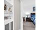 View into bedroom featuring neutral colors, hardwood floors, and nautical decorations throughout at 1300 Park West Blvd # 215, Mount Pleasant, SC 29466