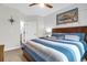 Bright bedroom with blue striped bedding, nautical decor, and plenty of natural light at 1300 Park West Blvd # 215, Mount Pleasant, SC 29466