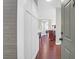 Bright foyer featuring pristine wainscoting and dark hardwood floors at 1300 Park West Blvd # 215, Mount Pleasant, SC 29466